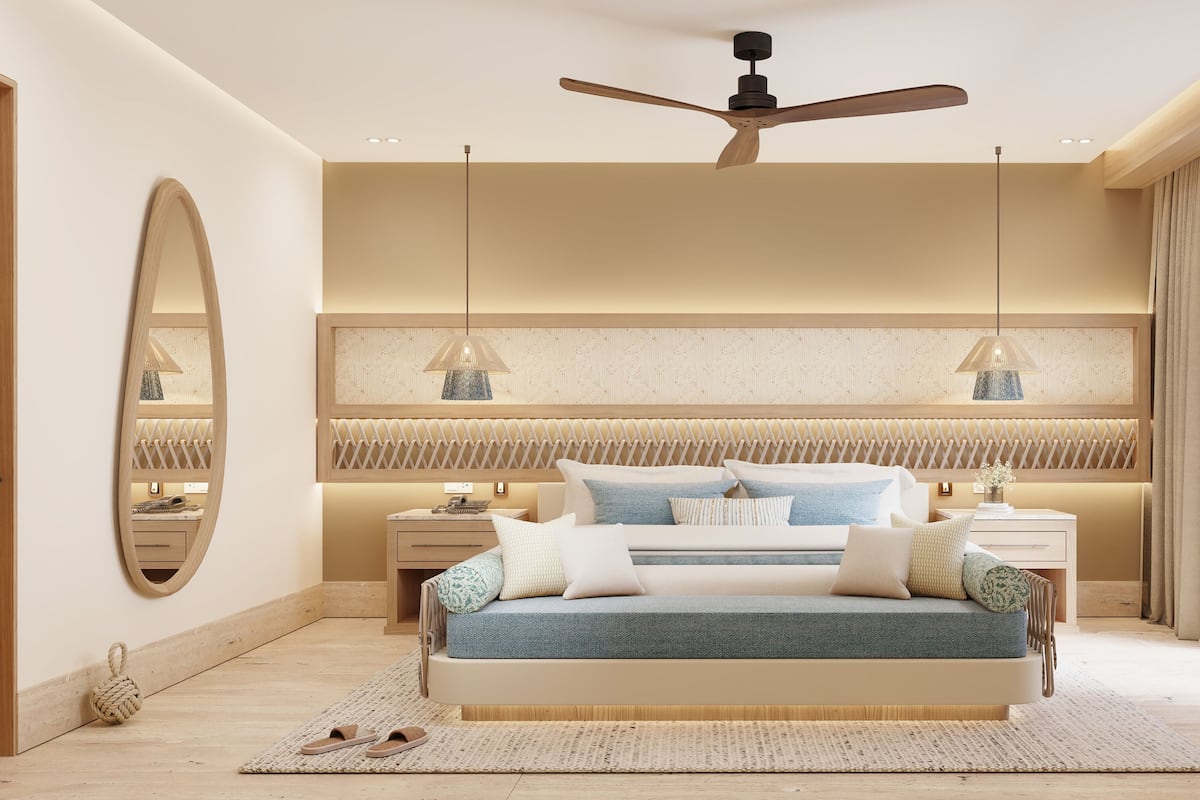 A modern bedroom with a bed, bedside tables, a ceiling fan, and a large window.