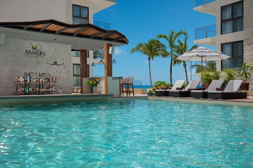 2 bars/lounges, 2 beach bars, poolside bar