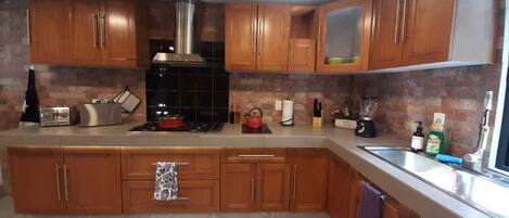 Fridge, microwave, coffee/tea maker, toaster