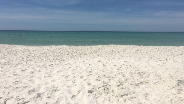 A beach with white sand and a calm sea under a clear sky. - Family&Pre-Approved Pet Friendly Condo Gated Complex Bed 3 Bath 3 walk2Tootsies (Panama City Beach)