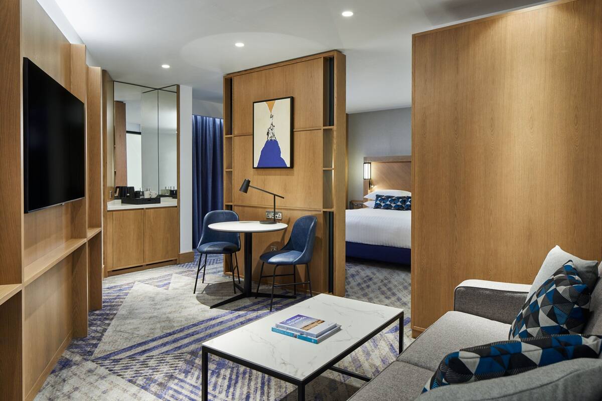 junior suite, 1 king bed with sofa bed, non smoking | living area | 55-inch flat-screen tv with digital channels, tv