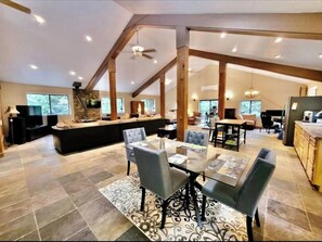 Relax in this open-plan living area with a high ceiling and central seating area.