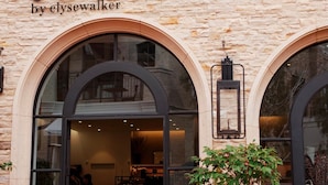 A storefront with the sign "towne by elysewalker" and a wheelchair accessibility symbol.