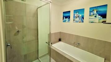 Bathtub, hair dryer, towels, soap