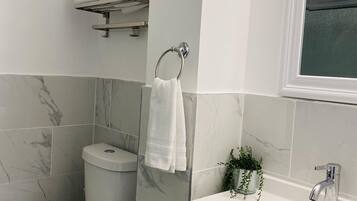 Shower, hair dryer, towels, soap