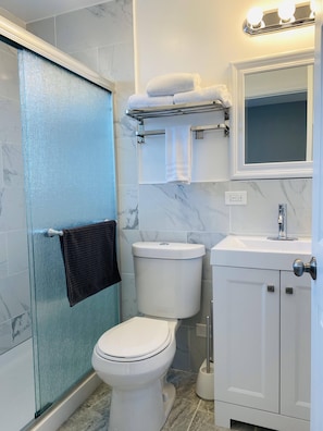 Shower, hair dryer, towels, soap