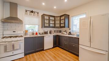 Enjoy cooking in this stylish kitchen with a gas stove, microwave, and dishwasher.
