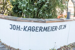 A white wall with the text 'JOH-KAGERMEIER-ST.24' in black letters.