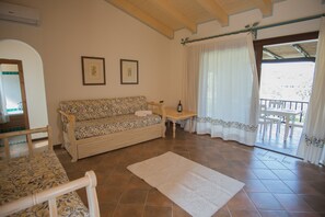 Classic Apartment, 1 Bedroom | Living area | Flat-screen TV - Il Giardino degli Oleandri (Arzachena)