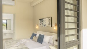 A bedroom with a bed, a window, a wall-mounted light, and a painting. - Royal Green (Moka)