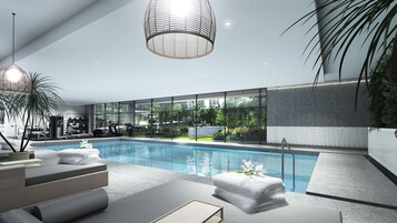 A modern indoor swimming pool with exercise equipment, large windows, and a clean, minimalist design.