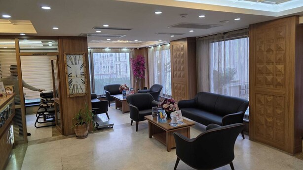 A modern hotel lobby with a reception desk, seating area, and large windows. - Hotel La SERA (Istanbul)