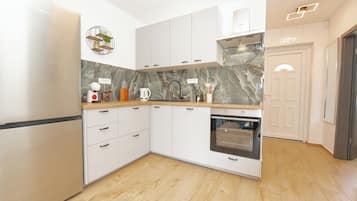Apartment | Private kitchen | Fridge, oven, stovetop, dishwasher