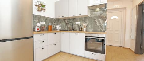 Apartment | Private kitchen | Fridge, oven, stovetop, dishwasher