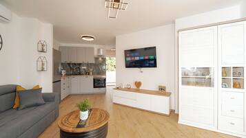 Apartment | Living area | 70-inch LCD TV with satellite channels, TV