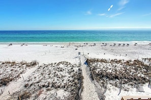 Relax on the beach with ocean views and comfortable lounge chairs.