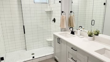 Combined shower/tub, hair dryer, towels, soap