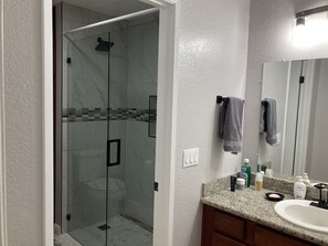 Shower, towels, soap, toilet paper