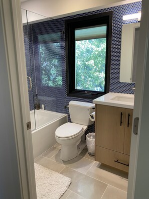 Combined shower/tub, hair dryer, towels, soap