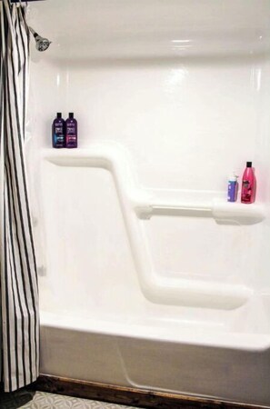 Combined shower/tub, hair dryer, towels, soap