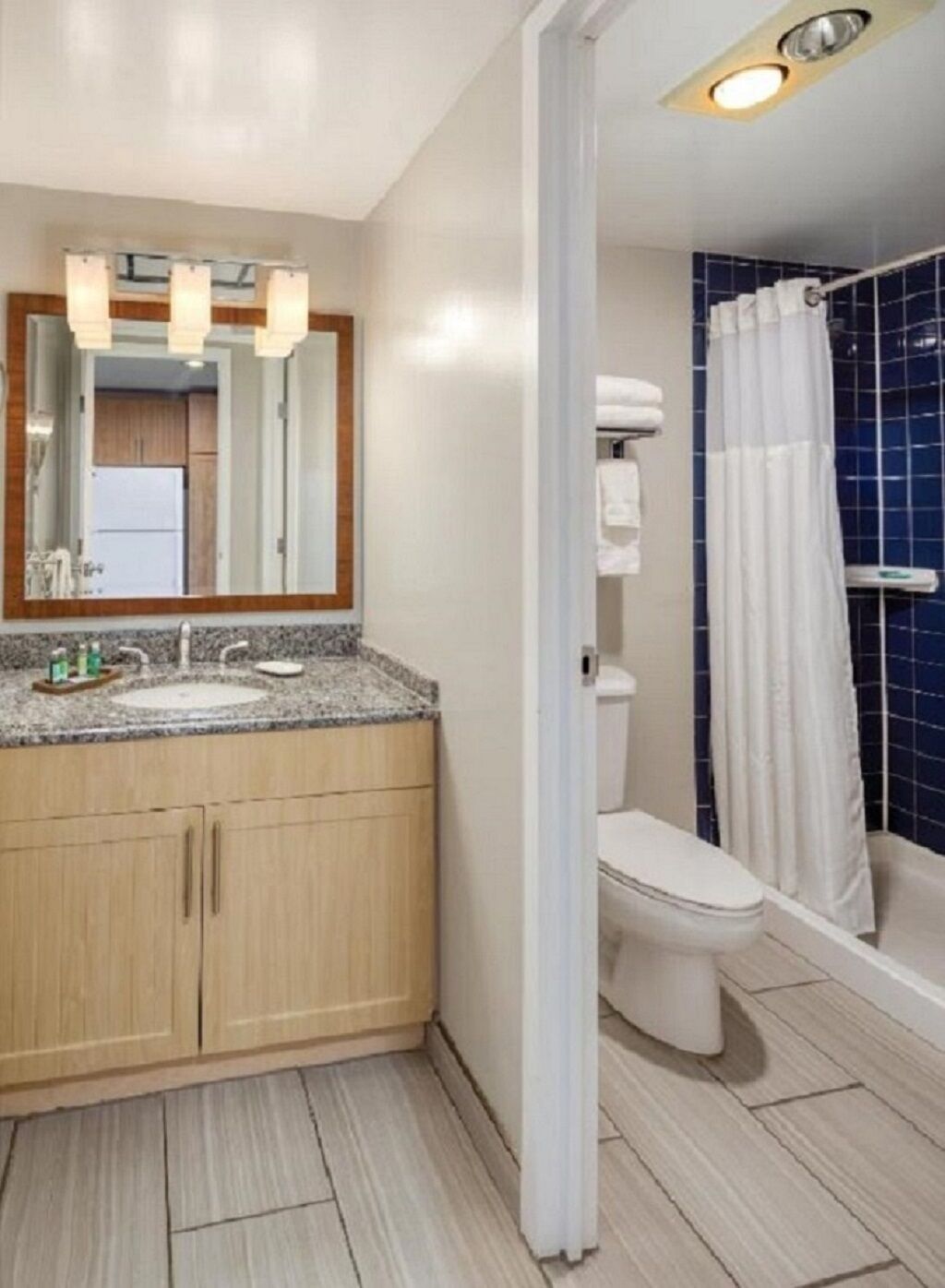 Combined shower/bathtub, hair dryer, towels, soap