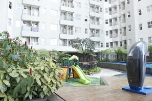 Children’s play area – outdoor - Cozy 2BR Apartment at Parahyangan Residence Bandung near UNPAR (Bandung)