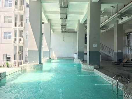 Outdoor pool. Appropriate Studio Apartment at Harvard Jatinangor near IPDN