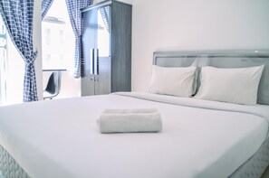 1 bedroom, free WiFi, bed sheets - Chic and Cozy Studio at Serpong Garden Apartment (Cisauk)