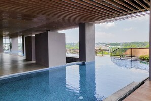 Outdoor pool - Cozy 1BR at The Ayoma Apartment (South Tangerang)
