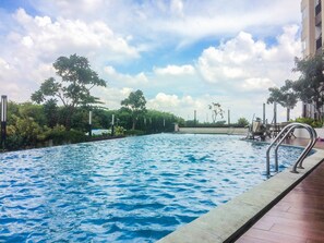 Outdoor pool - Clean and Elegant 1BR at The Oasis Apartment (Cikarang)