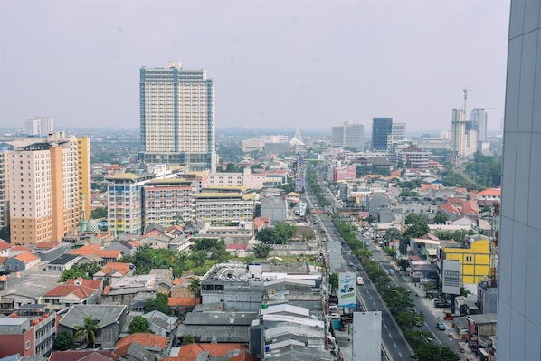 A cityscape with various buildings, including high-rise apartments and commercial structures.