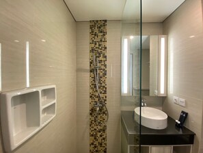 Shower, free toiletries, towels - Modern and Spacious Studio Room at Green Kosambi Apartment (Bandung)