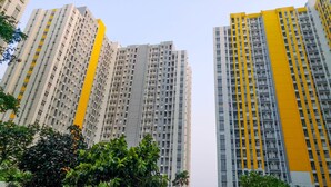 A high-rise residential building with multiple balconies and a modern architectural design. - Modern Furnished Studio at Springlake Summarecon Bekasi Apartment (Bekasi)