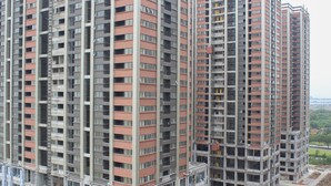 A high-rise residential building with multiple balconies and a central core structure. - Comfort and Nice 2BR at Meikarta Apartment (Cikarang)