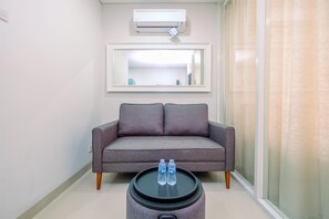 TV - Cozy Living 1BR Apartment at Atlanta Residences (Depok)
