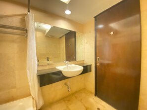Room | Bathroom | Shower, free toiletries, towels - Prime & Cozy 3BR at Braga City Walk Apartment (Bandung)