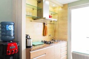 Room | Private kitchen | Fridge, stovetop, cookware/dishes/utensils - Comfy and Spacious 2BR at Seasons City Apartment (Jakarta)