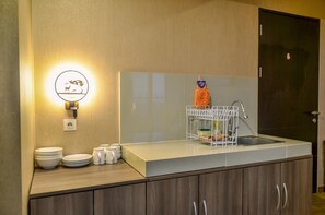 Fridge, stovetop, cookware/dishes/utensils - Nice and Cozy 2BR Apartment at Atria Residence (Gading Serpong)