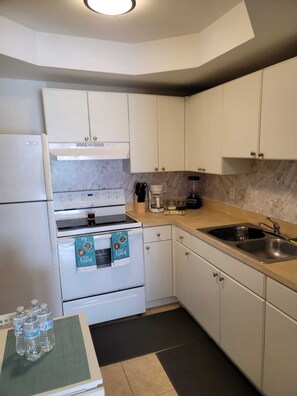 Fridge, microwave, stovetop, coffee/tea maker