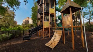 A playground with a slide, climbing structures, and a swing set. - OCEANFRONT Marriott's OceanWatch Resort, 2BR2BA Garden view Villa NO clean fee (Myrtle Beach)