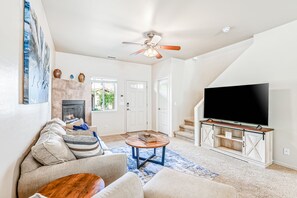 TV, fireplace, books