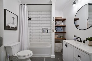 Combined shower/bathtub, hair dryer, towels, soap