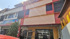 A multi-story building with a storefront. - Hotel O My Seven Days Inn (Masai)