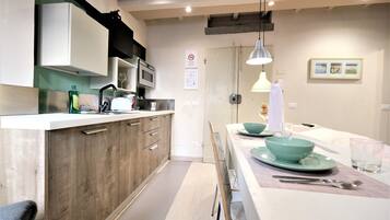 City Apartment | Living area | 42-inch Smart TV with digital channels, TV