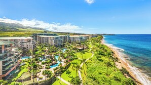 A resort with multiple buildings, a beachfront, and a pool area. - Beautiful Oceanfront Corner Unit - Honua Kai 215 (Lahaina)
