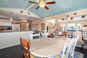 A spacious kitchen with white cabinets, a central island, and a ceiling fan. - Sound Chief: Hot Tub, Golf Views, Pool Access (Nags Head)
