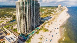 A high-rise hotel with a pool area and beach access. - The Oasis At Orange Beach 2706 by Liquid Life (Orange Beach)