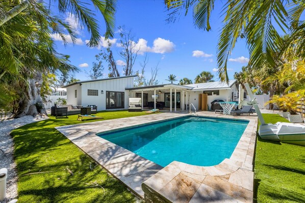 A heated pool - Glad Tidings: Heated pool, turfed outdoor lounge and dining area. (Anna Maria)