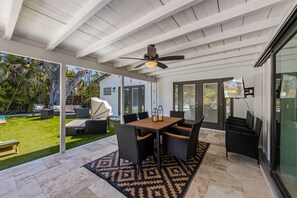 Outdoor dining - Glad Tidings: Heated pool, turfed outdoor lounge and dining area. (Anna Maria)
