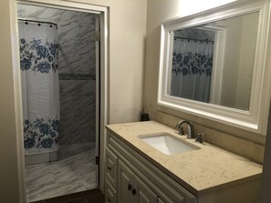 Shower, hair dryer, towels, soap